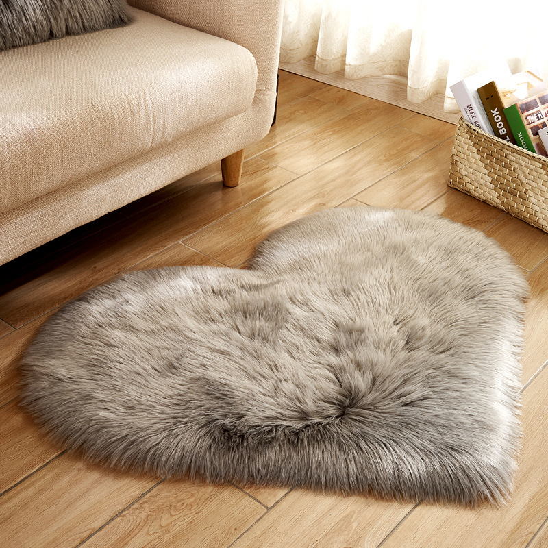 Plush home heart-shaped rug by the bedroom bed