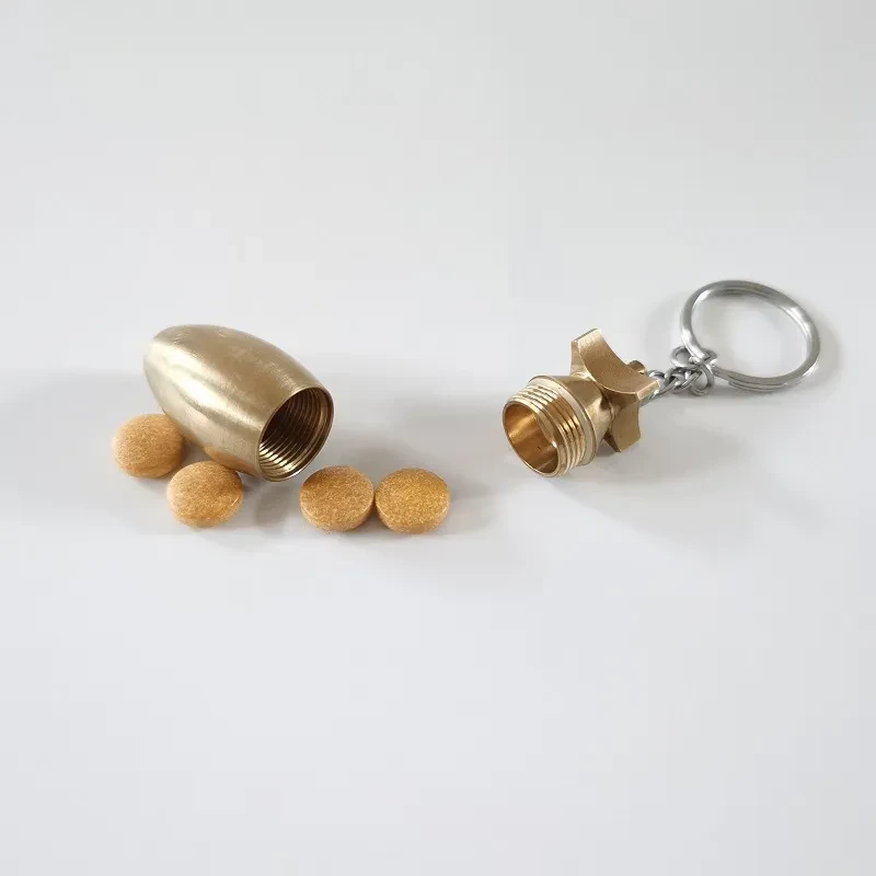A Brass Bomb Shaped Medicine Bottle Keychain