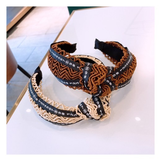 Handmade twisted letter ribbon with knotted headband in the middle