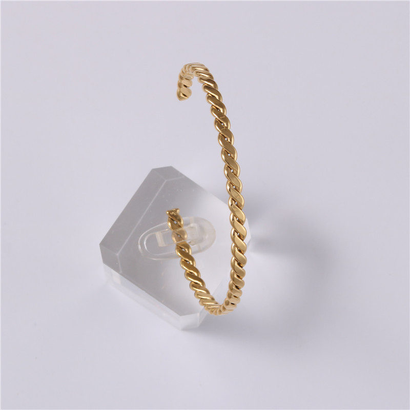 Embossed woven metal bracelet
